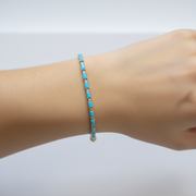 CB972771TQ5X3. 18K Sold Gold Diamond & Turquoise Bracelet